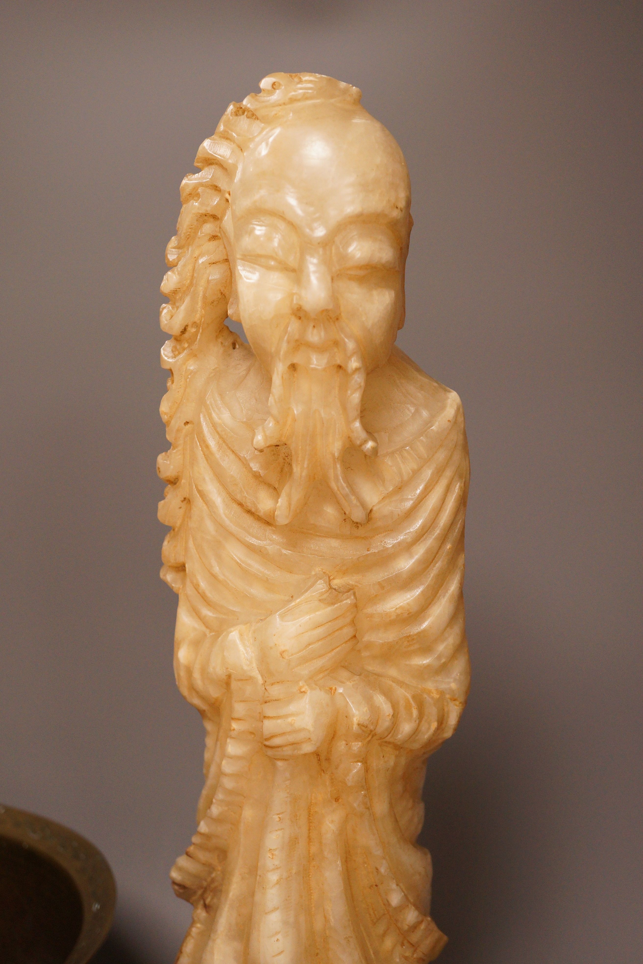 A Chinese bronze 'dragon' bowl, early 20th century and a large Chinese soapstone figure of Shou Lao, 28cm tall